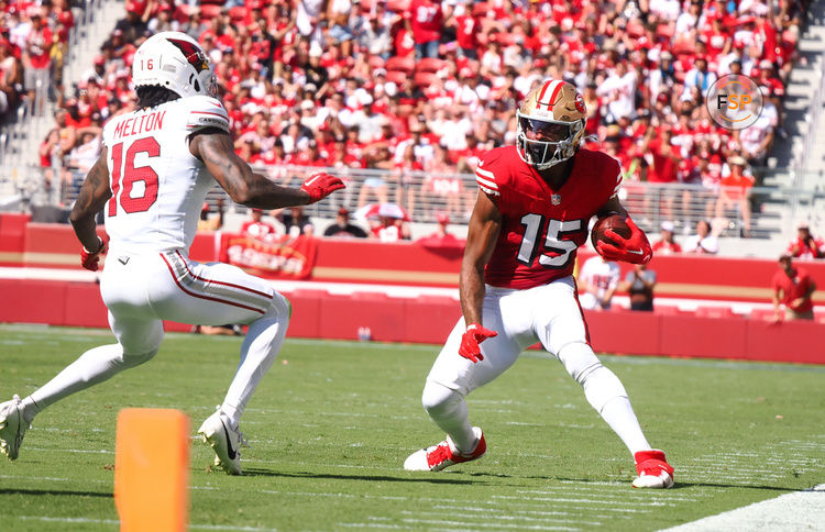 Oct 6, 2024; Santa Clara, California, USA; San Francisco 49ers wide receiver Jauan Jennings (15) controls the ball against Arizona Cardinals cornerback Max Melton (16) during the first quarter at Levi's Stadium. Credit: Kelley L Cox-Imagn Images