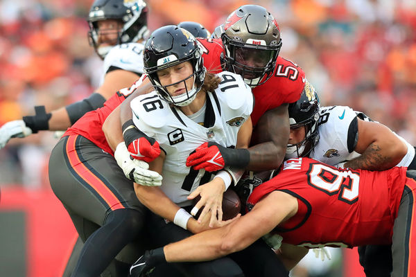 TAMPA, FL - DECEMBER 24: Tampa Bay Buccaneers Linebacker Lavonte David (54) eyes Jacksonville Jaguars Quarterback Trevor Lawrence (16) and then David wraps up Lawrence for the sack during the regular season game between the Jacksonville Jaguars and the Tampa Bay Buccaneers on December 24, 2023 at Raymond James Stadium in Tampa, Florida. (Photo by Cliff Welch/Icon Sportswire)