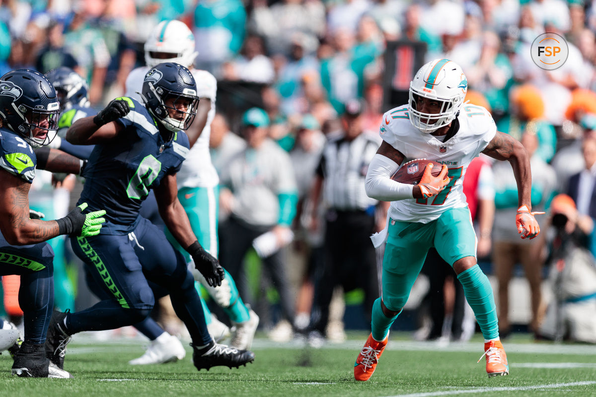 Sep 22, 2024; Seattle, Washington, USA; Miami Dolphins wide receiver Jaylen Waddle (17) runs with the ball during the second quarter against Seattle Seahawks at Lumen Field. Credit: Kevin Ng-Imagn Images