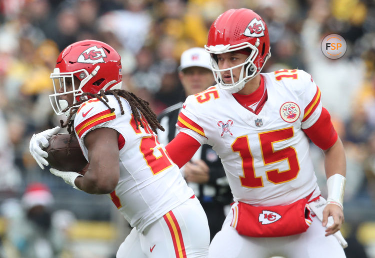 Dec 25, 2024; Pittsburgh, Pennsylvania, USA;  Kansas City Chiefs running back Kareem Hunt (29) takes a hand-off from quarterback Patrick Mahomes (15) against the Pittsburgh Steelers during the first quarter at Acrisure Stadium. Credit: Charles LeClaire-Imagn Images