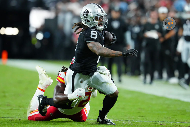 Oct 27, 2024; Paradise, Nevada, USA; Las Vegas Raiders running back Ameer Abdullah (8) is tackled by Kansas City Chiefs linebacker Nick Bolton (32) during the fourth quarter at Allegiant Stadium. Credit: Stephen R. Sylvanie-Imagn Images