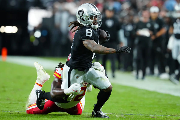 Oct 27, 2024; Paradise, Nevada, USA; Las Vegas Raiders running back Ameer Abdullah (8) is tackled by Kansas City Chiefs linebacker Nick Bolton (32) during the fourth quarter at Allegiant Stadium. Mandatory Credit: Stephen R. Sylvanie-Imagn Images