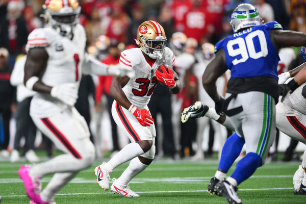 Oct 10, 2024; Seattle, Washington, USA; San Francisco 49ers running back Patrick Taylor Jr. (32) carries the ball against the Seattle Seahawks during the second half at Lumen Field. Mandatory Credit: Steven Bisig-Imagn Images