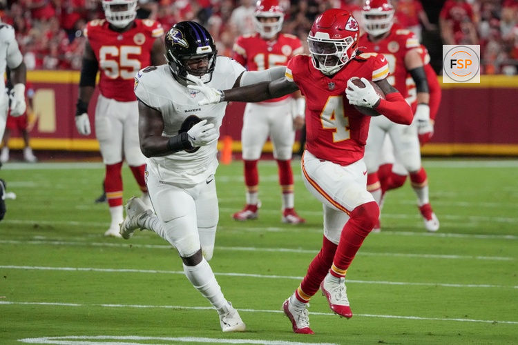 Sep 5, 2024; Kansas City, Missouri, USA; Kansas City Chiefs wide receiver Rashee Rice (4) runs the ball as Baltimore Ravens linebacker Roquan Smith (0) attempts the tackle during the game at GEHA Field at Arrowhead Stadium. Credit: Denny Medley-Imagn Images