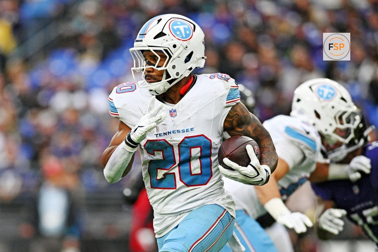Oct 4, 2026; Baltimore, Maryland, USA;  Tennessee Titans running back Tony Pollard (20) runs the ball during the third quarter against the Baltimore Ravens at M&T Bank Stadium.  Credit: Tommy Gilligan-Imagn Images