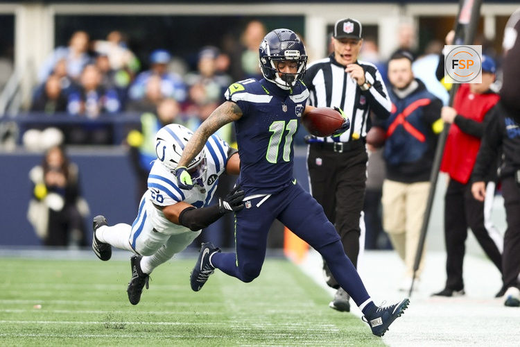 Dec 14, 2025; Seattle, Washington, USA; Seattle Seahawks wide receiver Jaxon Smith-Njigba (11) runs for yards after the catch against the Indianapolis Colts at Lumen Field. Credit: Kevin Ng-Imagn Images