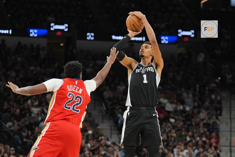 Nov 8, 2025; San Antonio, Texas, USA;  San Antonio Spurs forward Victor Wembanyama (1) shoots over New Orleans Pelicans center Derik Queen (22) in the second half at Frost Bank Center. Credit: Daniel Dunn-Imagn Images