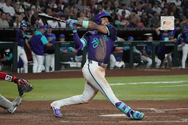 Sep 5, 2025; Phoenix, Arizona, USA; Arizona Diamondbacks second base Ketel Marte (4) hits against the Boston Red Sox in the eighth inning at Chase Field. Credit: Rick Scuteri-Imagn Images
