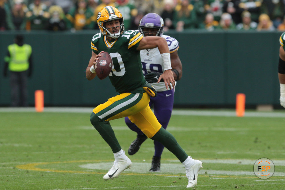 GREEN BAY, WI - OCTOBER 29: Green Bay Packers quarterback Jordan Love (10) is chased out of the pocket during a game between the Green Bay Packers and the Minnesota Vikings on October 29, 2023 at Lambeau Field, in Green Bay, WI. (Photo by Larry Radloff/Icon Sportswire)