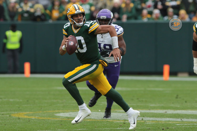 GREEN BAY, WI - OCTOBER 29: Green Bay Packers quarterback Jordan Love (10) is chased out of the pocket during a game between the Green Bay Packers and the Minnesota Vikings on October 29, 2023 at Lambeau Field, in Green Bay, WI. (Photo by Larry Radloff/Icon Sportswire)