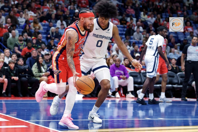Nov 26, 2025; New Orleans, Louisiana, USA; New Orleans Pelicans guard Jose Alvarado (15) dribbles around Memphis Grizzlies forward Jaylen Wells (0) during the second half at Smoothie King Center. Credit: Matthew Hinton-Imagn Images