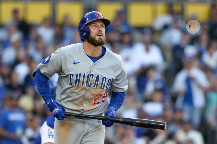 Apr 13, 2025; Los Angeles, California, USA; Chicago Cubs first base Michael Busch (29) watches after hitting a solo home run against the Los Angeles Dodgers during the sixth inning during the sixth inning of the game at Dodger Stadium. Credit: Kiyoshi Mio-Imagn Images