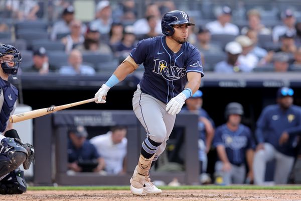 Jul 31, 2025; Bronx, New York, USA; Tampa Bay Rays first baseman Jonathan Aranda (62) follows through on an RBI single against the New York Yankees during the fourth inning at Yankee Stadium. Mandatory Credit: Brad Penner-Imagn Images