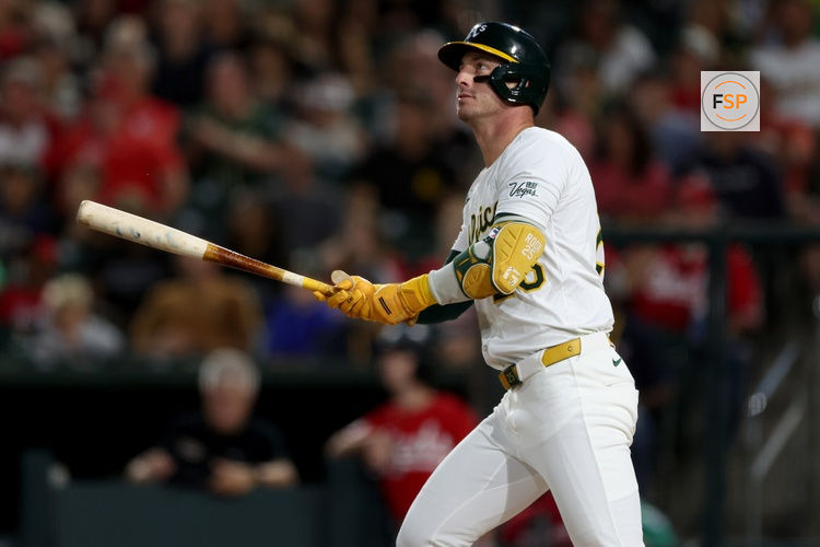 Sep 13, 2025; West Sacramento, California, USA; Athletics designated hitter Brent Rooker (25) hits a solo home run against the Cincinnati Reds during the second inning at Sutter Health Park. Credit: Dennis Lee-Imagn Images