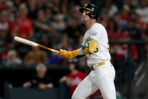 Sep 13, 2025; West Sacramento, California, USA; Athletics designated hitter Brent Rooker (25) hits a solo home run against the Cincinnati Reds during the second inning at Sutter Health Park. Mandatory Credit: Dennis Lee-Imagn Images