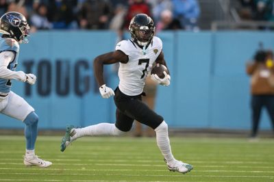 Nov 30, 2025; Nashville, Tennessee, USA;  Jacksonville Jaguars wide receiver Brian Thomas Jr. (7) runs with the ball after a made catch against the Tennessee Titans during the second half at Nissan Stadium. Mandatory Credit: Steve Roberts-Imagn Images