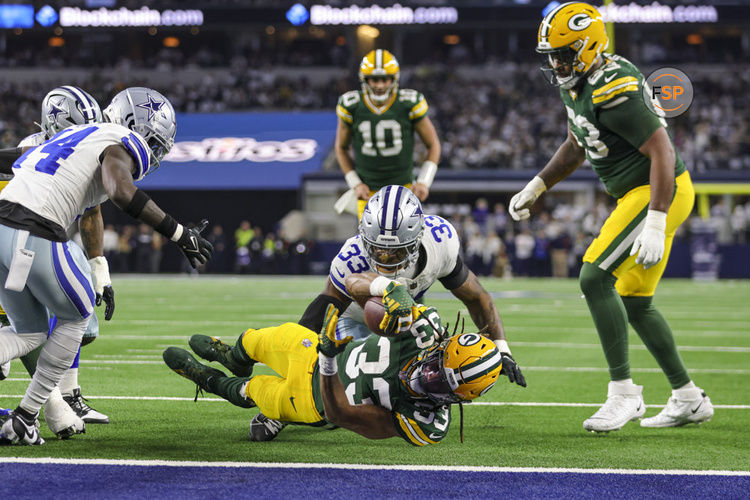 ARLINGTON, TX - JANUARY 14: Green Bay Packers running back Aaron Jones (33) scores a touchdown during the NFC Wild Card game between the Dallas Cowboys and the Green Bay Packers on January 14, 2024 at AT&T Stadium in Arlington, Texas. (Photo by Matthew Pearce/Icon Sportswire)