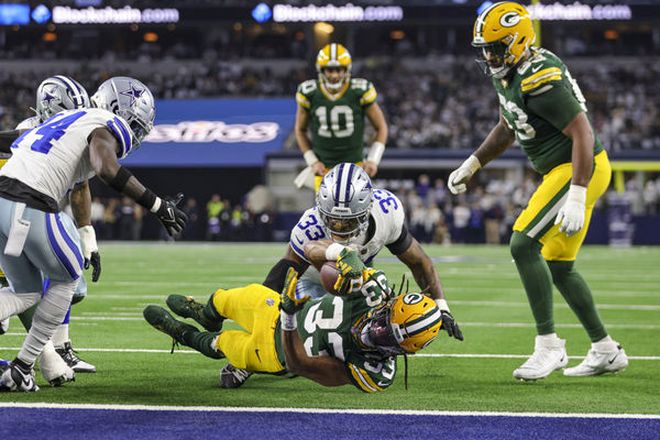 ARLINGTON, TX - JANUARY 14: Green Bay Packers running back Aaron Jones (33) scores a touchdown during the NFC Wild Card game between the Dallas Cowboys and the Green Bay Packers on January 14, 2024 at AT&T Stadium in Arlington, Texas. (Photo by Matthew Pearce/Icon Sportswire)