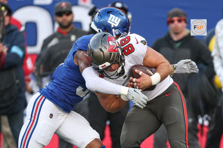 Nov 24, 2024; East Rutherford, New Jersey, USA; Tampa Bay Buccaneers tight end Cade Otton (88) is tackled by New York Giants safety Tyler Nubin (31) during the first half at MetLife Stadium. Credit: Vincent Carchietta-Imagn Images