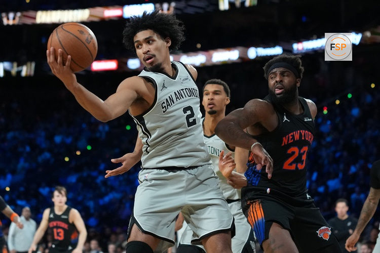 Dec 16, 2025; Las Vegas, Nevada, USA; San Antonio Spurs guard Dylan Harper (2) grabs a rebound against the New York Knicks in the second half during the Emirates NBA Cup Final at T-Mobile Arena. Credit: Kirby Lee-Imagn Images