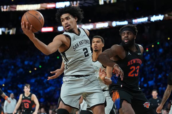 Dec 16, 2025; Las Vegas, Nevada, USA; San Antonio Spurs guard Dylan Harper (2) grabs a rebound against the New York Knicks in the second half during the Emirates NBA Cup Final at T-Mobile Arena. Mandatory Credit: Kirby Lee-Imagn Images