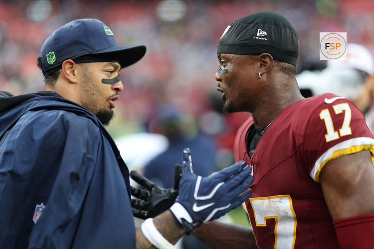 Sep 27, 2026; Landover, Maryland, USA; Washington Commanders wide receiver Terry McLaurin (17) shakes hands with Seattle Seahawks wide receiver Jaxon Smith-Njigba (L) after their game at Northwest Stadium. Credit: Geoff Burke-Imagn Images