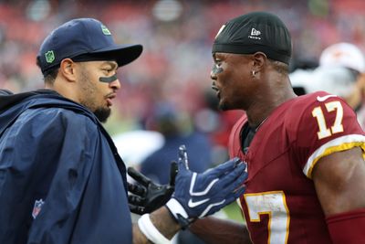 Sep 27, 2026; Landover, Maryland, USA; Washington Commanders wide receiver Terry McLaurin (17) shakes hands with Seattle Seahawks wide receiver Jaxon Smith-Njigba (L) after their game at Northwest Stadium. Mandatory Credit: Geoff Burke-Imagn Images