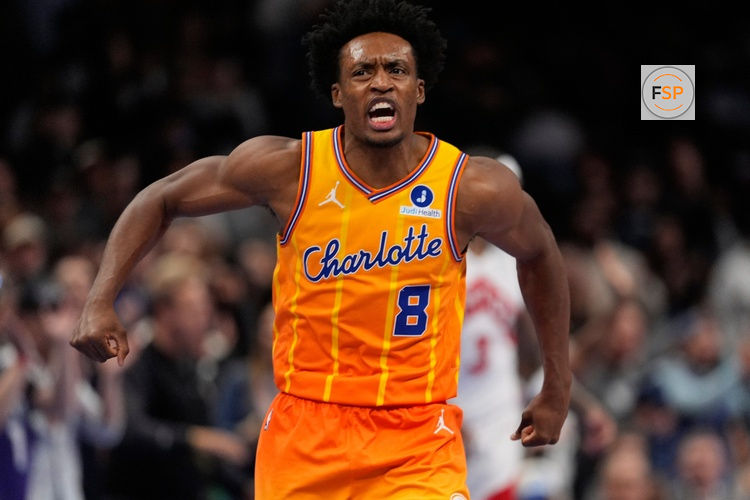 Nov 29, 2025; Charlotte, North Carolina, USA; Charlotte Hornets guard Collin Sexton (8) reacts after defeating the Toronto Raptors in overtime at Spectrum Center. Credit: Jim Dedmon-Imagn Images