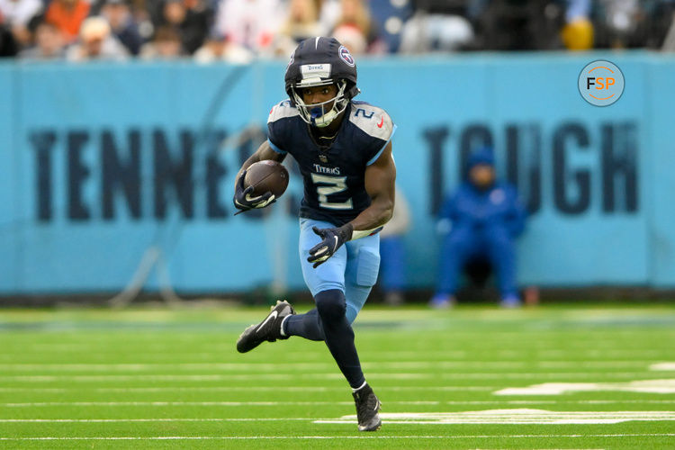 Dec 15, 2024; Nashville, Tennessee, USA;  Tennessee Titans running back Tyjae Spears (2) runs with the ball after a made catch against the Cincinnati Bengals during the second half at Nissan Stadium. Credit: Steve Roberts-Imagn Images