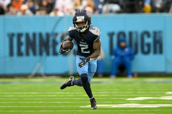 Dec 15, 2024; Nashville, Tennessee, USA;  Tennessee Titans running back Tyjae Spears (2) runs with the ball after a made catch against the Cincinnati Bengals during the second half at Nissan Stadium. Mandatory Credit: Steve Roberts-Imagn Images