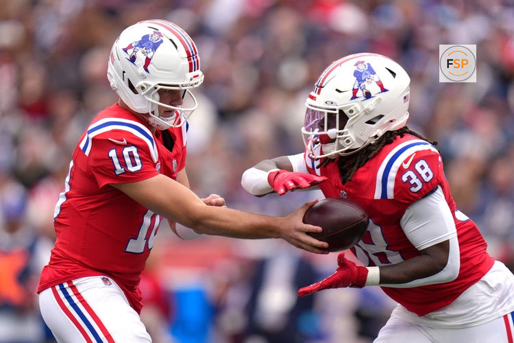 Oct 11, 2026; Foxborough, Massachusetts, USA;  New England Patriots quarterback Drake Maye (10) hands the ball to running back Rhamondre Stevenson (38) against the Las Vegas Raiders during the first quarter at Gillette Stadium.  Credit: David Butler II-Imagn Images