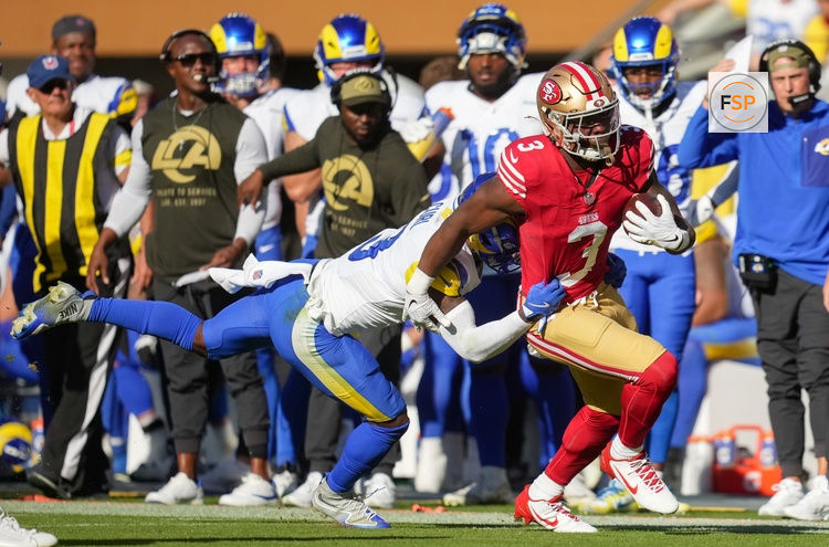 Nov 9, 2025; Santa Clara, California, USA; San Francisco 49ers running back Brian Robinson Jr. (3) runs the ball against Los Angeles Rams safety Kam Curl (3) during the second quarter at Levi's Stadium. Credit: Cary Edmondson-Imagn Images