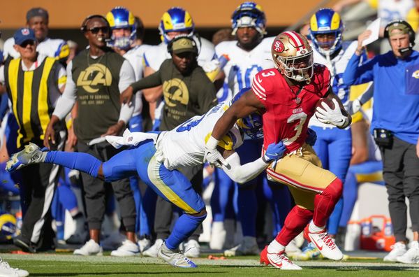 Nov 9, 2025; Santa Clara, California, USA; San Francisco 49ers running back Brian Robinson Jr. (3) runs the ball against Los Angeles Rams safety Kam Curl (3) during the second quarter at Levi's Stadium. Mandatory Credit: Cary Edmondson-Imagn Images