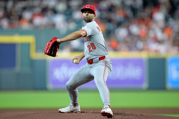 May 9, 2025; Houston, Texas, USA; Cincinnati Reds pitcher Nick Martinez (28) delivers a pitch against the Houston Astros during the first inning at Daikin Park. Mandatory Credit: Erik Williams-Imagn Images