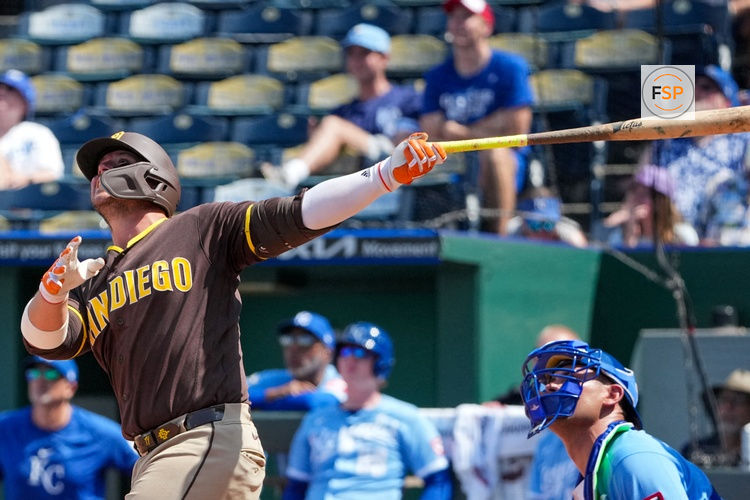 Jul 19, 2026; Kansas City, Missouri, USA; San Diego Padres first baseman Ty France (25) hits a grand slam against the Kansas City Royals during the eighth inning at Kauffman Stadium. Credit: Denny Medley-Imagn Images