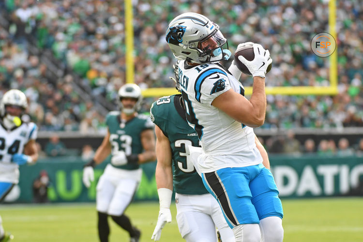 Dec 8, 2024; Philadelphia, Pennsylvania, USA; Carolina Panthers wide receiver Adam Thielen (19) makes a catch against Philadelphia Eagles cornerback Cooper DeJean (33) during the first quarter at Lincoln Financial Field. Credit: Eric Hartline-Imagn Images