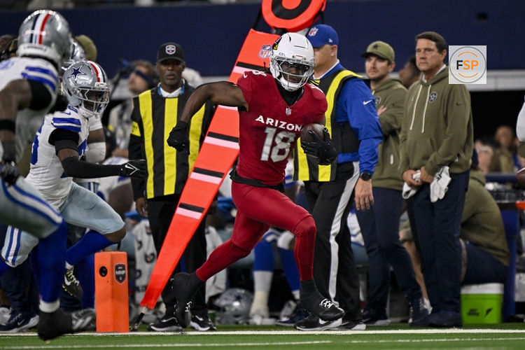 Nov 3, 2025; Arlington, Texas, USA; Arizona Cardinals wide receiver Marvin Harrison Jr. (18) runs with the ball past Dallas Cowboys cornerback DaRon Bland (26) during the game between the Dallas Cowboys and the Arizona Cardinals at AT&T Stadium. Credit: Jerome Miron-Imagn Images