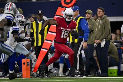 Nov 3, 2025; Arlington, Texas, USA; Arizona Cardinals wide receiver Marvin Harrison Jr. (18) runs with the ball past Dallas Cowboys cornerback DaRon Bland (26) during the game between the Dallas Cowboys and the Arizona Cardinals at AT&T Stadium. Mandatory Credit: Jerome Miron-Imagn Images