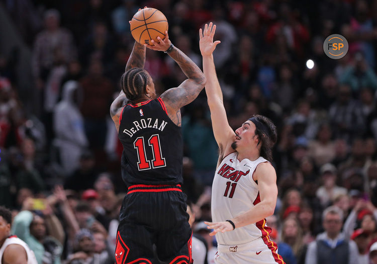 CHICAGO, IL - NOVEMBER 18: DeMar DeRozan #11 of the Chicago Bulls shoots a 3-point basket over Jaime Jaquez Jr. #11 of the Miami Heat during the second half at the United Center on November 18, 2023 in Chicago, Illinois. (Photo by Melissa Tamez/Icon Sportswire)