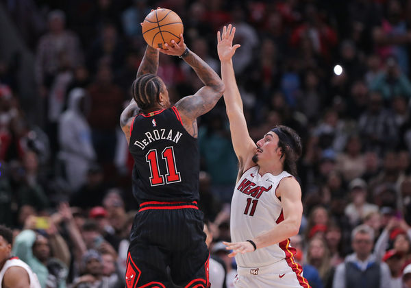 CHICAGO, IL - NOVEMBER 18: DeMar DeRozan #11 of the Chicago Bulls shoots a 3-point basket over Jaime Jaquez Jr. #11 of the Miami Heat during the second half at the United Center on November 18, 2023 in Chicago, Illinois. (Photo by Melissa Tamez/Icon Sportswire)