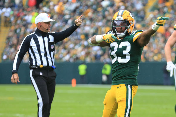 GREEN BAY, WI - NOVEMBER 05: Green Bay Packers running back Aaron Jones (33) and referee Clete Blakeman (34) signal first down during a game between the Green Bay Packers and the Los Angeles Rams at Lambeau Field on November 5, 2023 in Green Bay, WI. (Photo by Larry Radloff/Icon Sportswire)