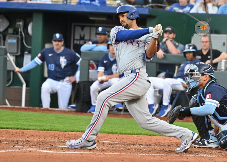 KANSAS CITY, MO - MAY 03: Texas Rangers second baseman Marcus Semien (2) doubles in the third inning during a MLB game on May 03, 2024, between the Texas Rangers and the Kansas City Royals at Kauffman Stadium, Kansas City, MO.  (Photo by Keith Gillett/Icon Sportswire)