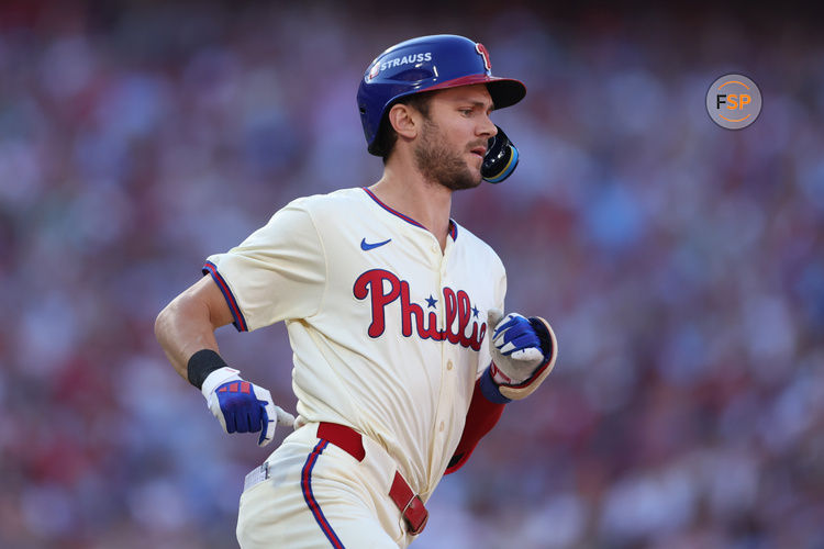 Oct 6, 2024; Philadelphia, Pennsylvania, USA; Philadelphia Phillies shortstop Trea Turner (7) advances to first base in the first inning against the New York Mets during game two of the NLDS for the 2024 MLB Playoffs at Citizens Bank Park. Credit: Bill Streicher-Imagn Images