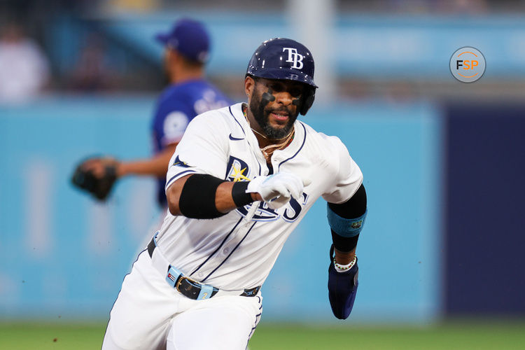 Jun 3, 2025; Tampa, Florida, USA; Tampa Bay Rays designated hitter Yandy Diaz (2) runs to third base against the Texas Rangers in the first inning at George M. Steinbrenner Field. Credit: Nathan Ray Seebeck-Imagn Images