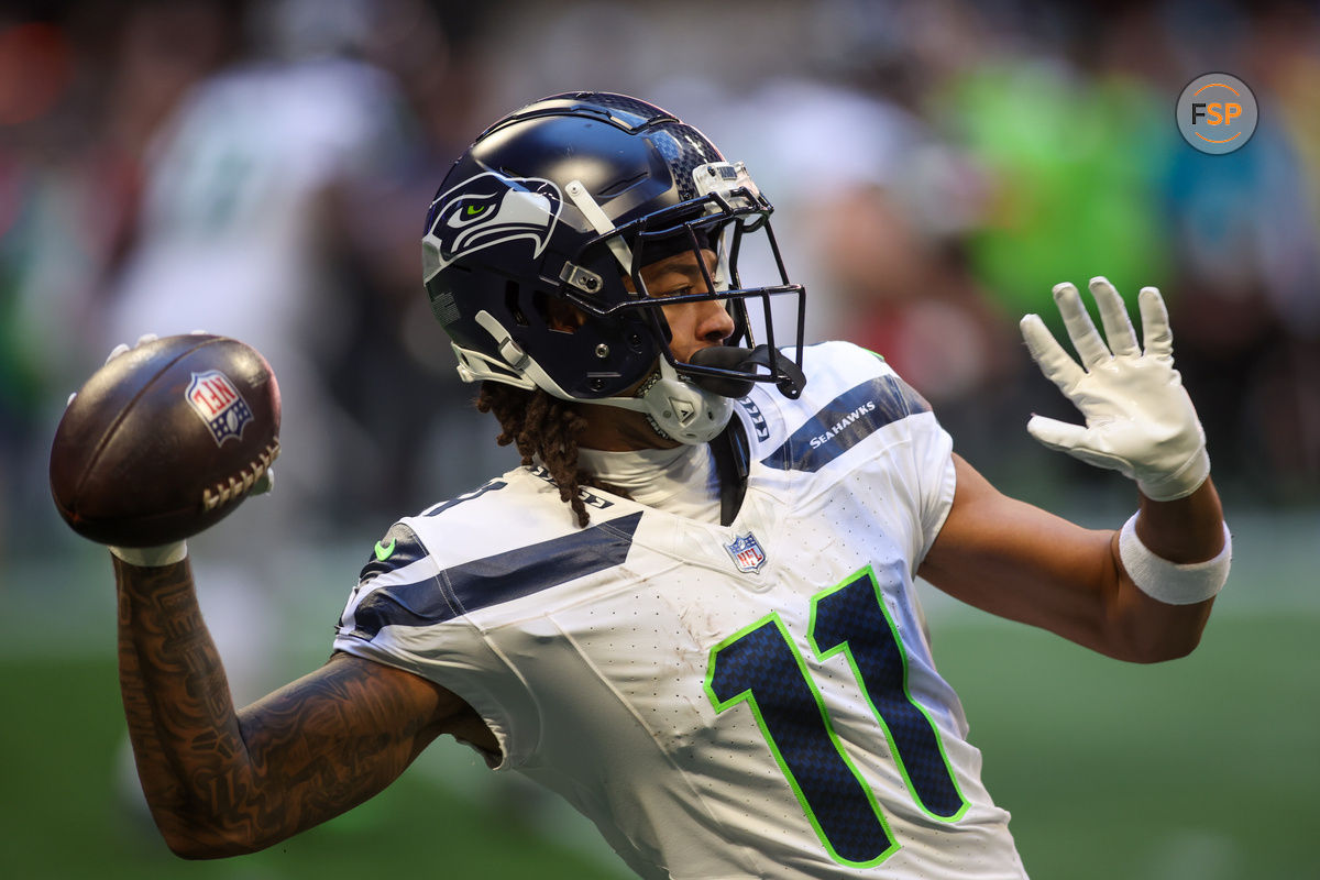 Oct 20, 2024; Atlanta, Georgia, USA; Seattle Seahawks wide receiver Jaxon Smith-Njigba (11) throws a pass against the Atlanta Falcons in the second quarter at Mercedes-Benz Stadium. Credit: Brett Davis-Imagn Images