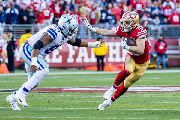 SANTA CLARA, CA - JANUARY 22: San Francisco 49ers running back Christian McCaffrey (23) tries to avoid a tackle during the NFL NFC Divisional Playoff game between the Dallas Cowboys and San Francisco 49ers on January 22, 2023, at Levi’s Stadium in Santa Clara, CA. (Photo by Bob Kupbens/Icon Sportswire)