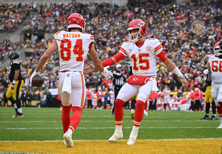 Dec 25, 2024; Pittsburgh, Pennsylvania, USA; Kansas City Chiefs wide receiver Justin Watson (84) celebrates an 11-yard touchdown with quarterback Patrick Mahomes (15)  against the Pittsburgh Steelers during the first quarter at Acrisure Stadium. Credit: Barry Reeger-Imagn Images