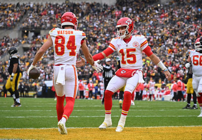 Dec 25, 2024; Pittsburgh, Pennsylvania, USA; Kansas City Chiefs wide receiver Justin Watson (84) celebrates an 11-yard touchdown with quarterback Patrick Mahomes (15)  against the Pittsburgh Steelers during the first quarter at Acrisure Stadium. Mandatory Credit: Barry Reeger-Imagn Images