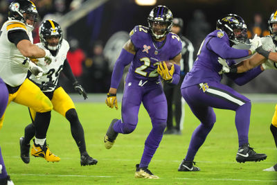 Dec 21, 2024; Baltimore, Maryland, USA; Baltimore Ravens running back Derrick Henry (22) runs for a gain against the Pittsburgh Steelers in the fourth quarter at M&T Bank Stadium. Mandatory Credit: Mitch Stringer-Imagn Images