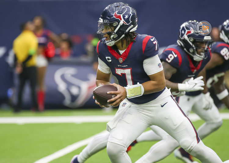 HOUSTON, TX - DECEMBER 03:  Houston Texans quarterback C.J. Stroud (7) prepares to hand off the ball in the second quarter during the football game between Denver Broncos and Houston Texans at NRG Stadium on December 3, 2023 in Houston, Texas.  (Photo by Leslie Plaza Johnson/Icon Sportswire)